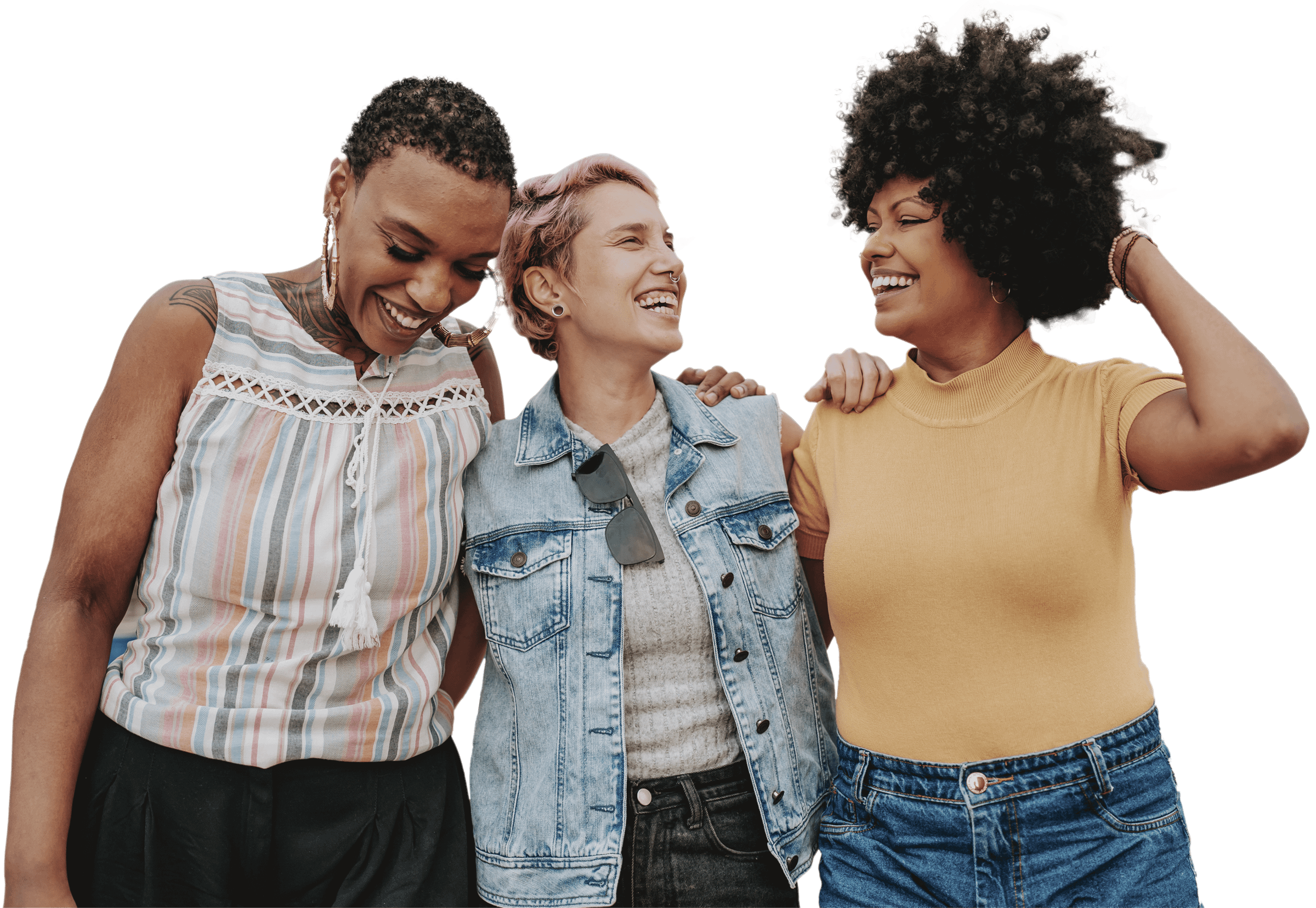 Three friends smiling and embracing outdoors