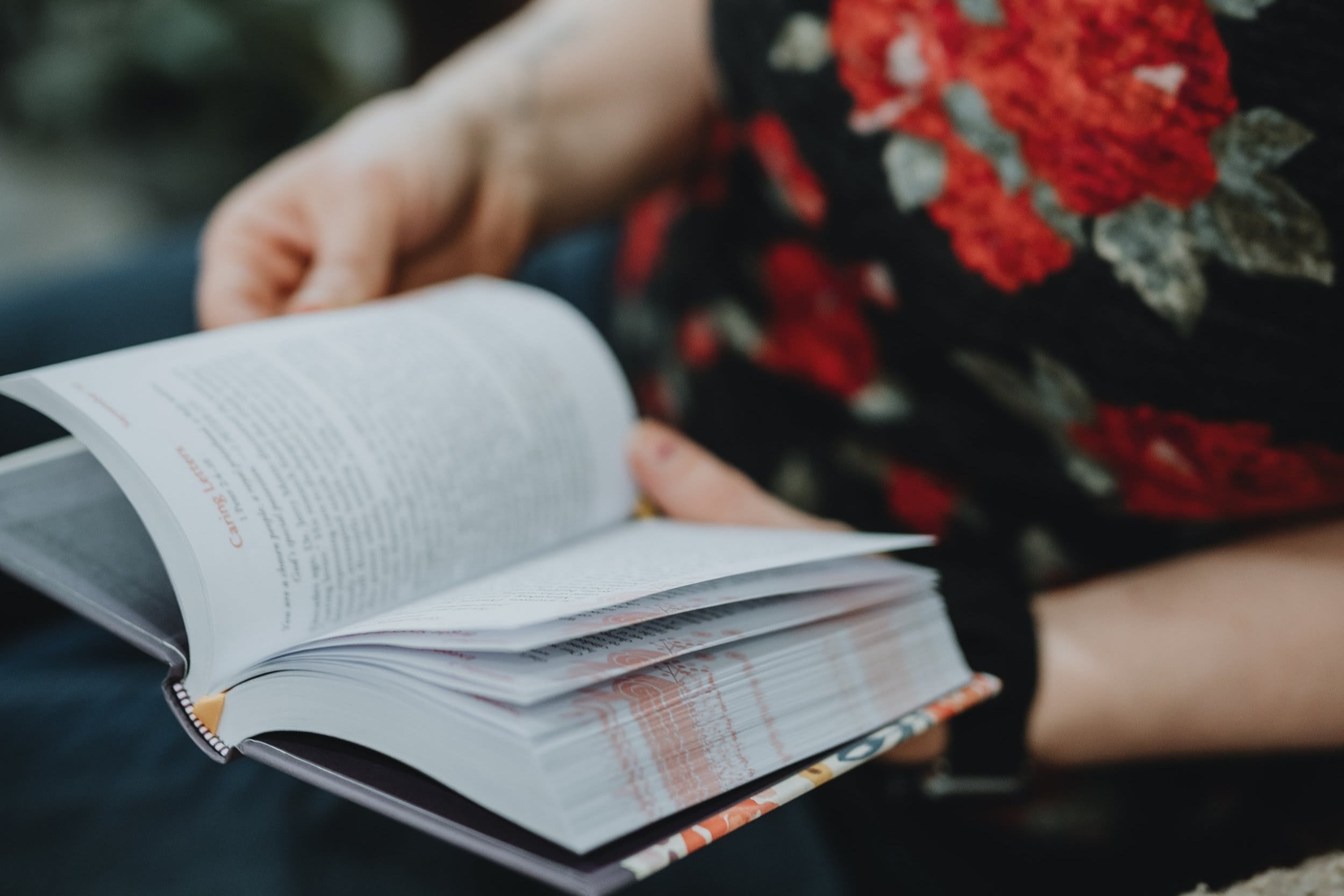 Person reading God Loves Her devotions